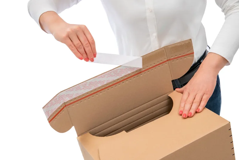 VariBox Plus Schutzfolie des Klebestreifens abziehen.